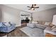 Comfortable living room with open access to the kitchen, fireplace and large windows at 13408 Portside Ln, Lancaster, SC 29720