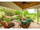 Backyard pond with waterfall feature, surrounded by lush greenery and comfortable seating in the outdoor space at 1418 Lonan Dr, Waxhaw, NC 28173