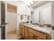 Bathroom featuring marble countertops, vanity, mirror, and bath/shower combo at 1418 Lonan Dr, Waxhaw, NC 28173