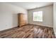 Bedroom featuring hardwood floors and dresser at 1418 Lonan Dr, Waxhaw, NC 28173