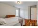 Bedroom featuring hardwood floors, closet space and natural light at 1418 Lonan Dr, Waxhaw, NC 28173