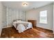 Bedroom featuring decorative wall, hardwood flooring and natural light at 1418 Lonan Dr, Waxhaw, NC 28173