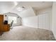 Bonus room with dormer window, neutral carpet, and a closet for ample storage solutions at 1418 Lonan Dr, Waxhaw, NC 28173