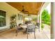 Covered patio with ceiling fans and outdoor seating that offers a relaxing space for outdoor gatherings at 1418 Lonan Dr, Waxhaw, NC 28173