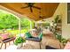 Spacious covered patio perfect for outdoor living with comfortable seating and lush backyard views at 1418 Lonan Dr, Waxhaw, NC 28173