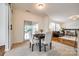 Charming dining area featuring a table for four and a sliding glass door to let in natural light at 1418 Lonan Dr, Waxhaw, NC 28173