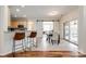 Bright dining area with sliding barn doors, sliding glass doors, and stylish hardwood and tile flooring at 1418 Lonan Dr, Waxhaw, NC 28173