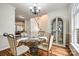 Elegant dining room with hardwood floors and views of the living areas at 1418 Lonan Dr, Waxhaw, NC 28173