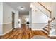 Open-concept foyer with hardwood floors leading to the kitchen and living areas at 1418 Lonan Dr, Waxhaw, NC 28173