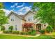 Inviting two-story home featuring stone accents, manicured lawn, and mature landscaping at 1418 Lonan Dr, Waxhaw, NC 28173