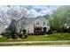 Charming two-story home with beautiful landscaping and a well-manicured lawn, enhancing curb appeal at 1418 Lonan Dr, Waxhaw, NC 28173