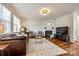 Comfortable living room with hardwood floors, fireplace, and ample natural light at 1418 Lonan Dr, Waxhaw, NC 28173