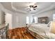 Spacious main bedroom with tray ceiling, ceiling fan and hardwood flooring at 1418 Lonan Dr, Waxhaw, NC 28173
