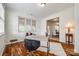 Office space featuring hardwood floors, a desk, and a reading area by the window at 1418 Lonan Dr, Waxhaw, NC 28173