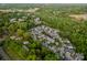 A beautiful aerial view showcasing a neighborhood surrounded by lush greenery and a golf course at 142 Aztec Cir, Mooresville, NC 28117