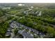 Aerial view displays lush, green neighborhoods in a desirable location near a quiet lake and a meandering stream at 142 Aztec Cir, Mooresville, NC 28117