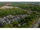 Aerial view captures this neighborhood's prime location near a school with lush greenery and well-maintained homes at 142 Aztec Cir, Mooresville, NC 28117