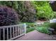 Well-maintained backyard features a deck and lush landscaping at 142 Aztec Cir, Mooresville, NC 28117