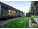 Green backyard features a lush lawn, mature trees, and privacy landscaping at 142 Aztec Cir, Mooresville, NC 28117