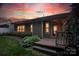 Charming backyard boasts a wooden deck and well-maintained garden, offering a serene outdoor space at 142 Aztec Cir, Mooresville, NC 28117