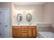 Bright bathroom features double sinks, soaking tub, and separate glass-door shower at 142 Aztec Cir, Mooresville, NC 28117