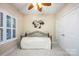 Cozy bedroom with natural light, plantation shutters, and neutral tones at 142 Aztec Cir, Mooresville, NC 28117