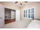 Cozy bedroom features shuttered window and closet space at 142 Aztec Cir, Mooresville, NC 28117