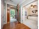Inviting entryway with a view into a cozy bedroom featuring shutters and a ceiling fan at 142 Aztec Cir, Mooresville, NC 28117