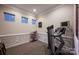Cozy exercise room featuring a treadmill, shelving unit, and ample space for a personalized workout routine at 142 Aztec Cir, Mooresville, NC 28117
