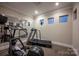 Well-equipped exercise room with treadmill, elliptical machine, and mirrored wall, promoting a healthy lifestyle at 142 Aztec Cir, Mooresville, NC 28117
