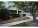 Inviting exterior with a well-kept lawn, charming front porch, and attached two-car garage at 142 Aztec Cir, Mooresville, NC 28117