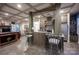 Spacious kitchen boasts granite countertops, stainless steel appliances, and a cozy seating area for gatherings at 142 Aztec Cir, Mooresville, NC 28117