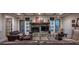 Comfortable living room features a stone fireplace, coffered ceilings, and ample seating, perfect for entertaining at 142 Aztec Cir, Mooresville, NC 28117