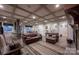 Open-concept living area featuring coffered ceilings, and comfortable seating, ideal for entertaining guests at 142 Aztec Cir, Mooresville, NC 28117