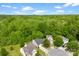Aerial shot of the community nestled in a lush green environment featuring manicured lawns and mature trees at 1457 Mandy Place Ct, Charlotte, NC 28216