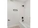 Contemporary bathroom features matte black fixtures and a clean, white tub/shower combination at 1457 Mandy Place Ct, Charlotte, NC 28216