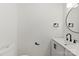 Half bathroom with modern vanity, black hardware, and updated fixtures at 1457 Mandy Place Ct, Charlotte, NC 28216