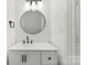 Bathroom featuring a modern vanity with sleek hardware, mirror, and updated lighting at 1457 Mandy Place Ct, Charlotte, NC 28216