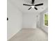 Bright bedroom boasts neutral carpet, a ceiling fan, and natural light from a large window at 1457 Mandy Place Ct, Charlotte, NC 28216