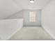 Neutral bedroom with plush carpet and plenty of natural light from a double hung window at 1457 Mandy Place Ct, Charlotte, NC 28216