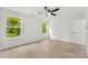 Bright bedroom with modern ceiling fan, ample natural light and light wood floors at 1457 Mandy Place Ct, Charlotte, NC 28216
