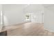 Spacious living room featuring wood-look floors and natural light at 1457 Mandy Place Ct, Charlotte, NC 28216