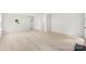 Spacious living room featuring wood-look floors and natural light at 1457 Mandy Place Ct, Charlotte, NC 28216