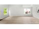 Bright living room featuring wood-look floors and natural light at 1457 Mandy Place Ct, Charlotte, NC 28216