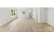 Bright living room featuring wood-look floors and natural light at 1457 Mandy Place Ct, Charlotte, NC 28216