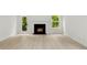 Bright living room featuring a fireplace and wood-look floors at 1457 Mandy Place Ct, Charlotte, NC 28216