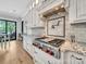 Modern kitchen featuring stainless steel appliances, custom white cabinetry, and granite countertops at 1579 Sunset Pointe Dr, Salisbury, NC 28146