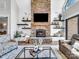 Inviting living room with a stone fireplace, built-in shelves, and comfortable seating, great for relaxation at 1579 Sunset Pointe Dr, Salisbury, NC 28146
