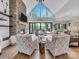 Bright living room features a stone fireplace, vaulted ceiling, and sliding glass doors to the backyard at 1579 Sunset Pointe Dr, Salisbury, NC 28146