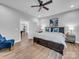 Spacious main bedroom with a cozy seating area, ample lighting, and hardwood flooring at 1579 Sunset Pointe Dr, Salisbury, NC 28146